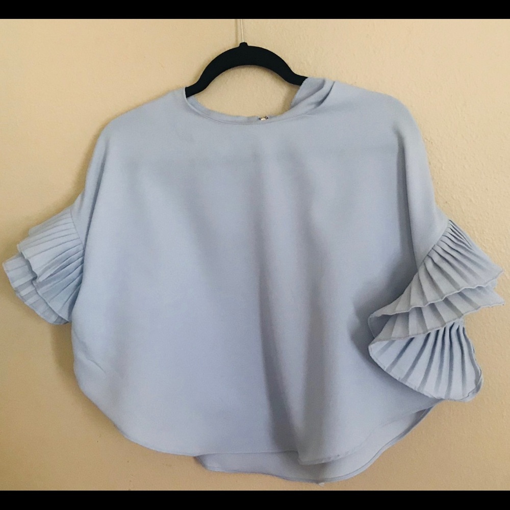 Light blue blouse with ruffles